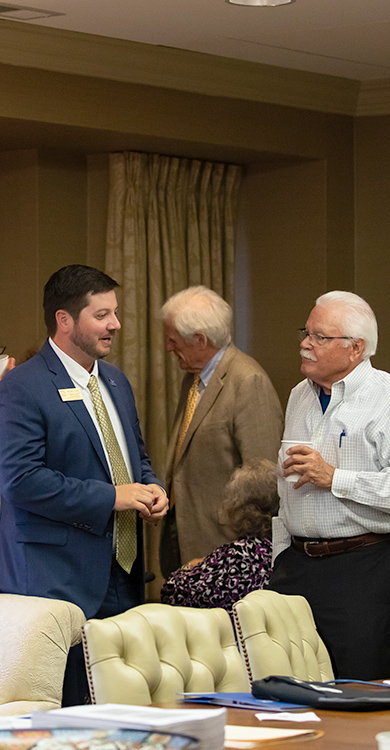 Taylor Cook with board member
