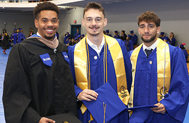 graduates at commencement