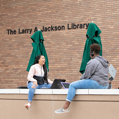 students outside library