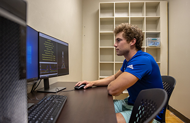 student with computer