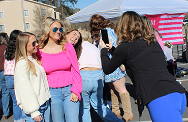 students taking phone photos