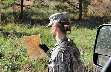 cadet looking at a map