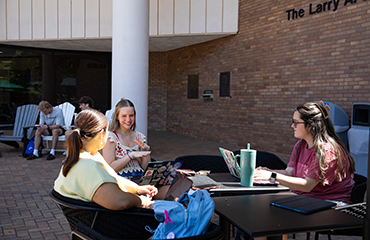 students outside library