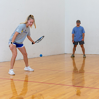 students in racquetball court