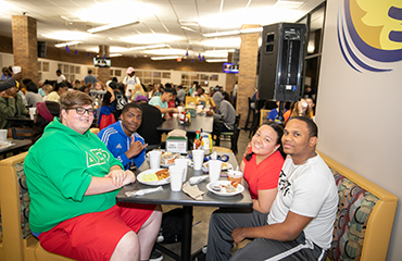 students eating in dining hall
