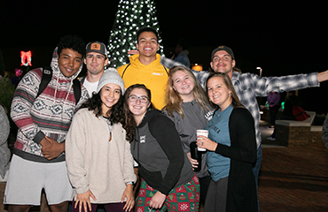 students with Christmas tree