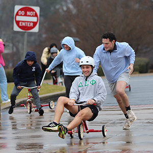 students in big wheel race
