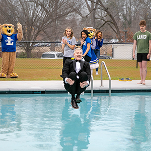 president jumping in the pool