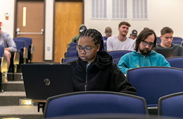 student in lecture hall