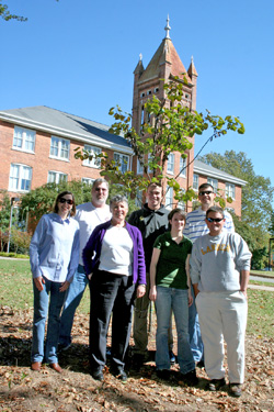 students planting tree for d-day survivor