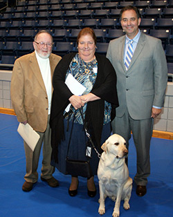 Jerry Wilson, Andi Mills and her service dog, Mr. Tibbs, and Ralph Patterson