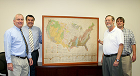 officials with rare map
