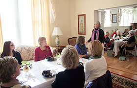 Sandra Hughes speaking at luncheon