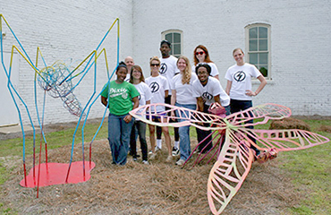 art students with bug sculptures