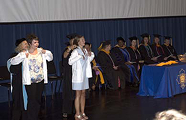 nursing students receive white lab coats
