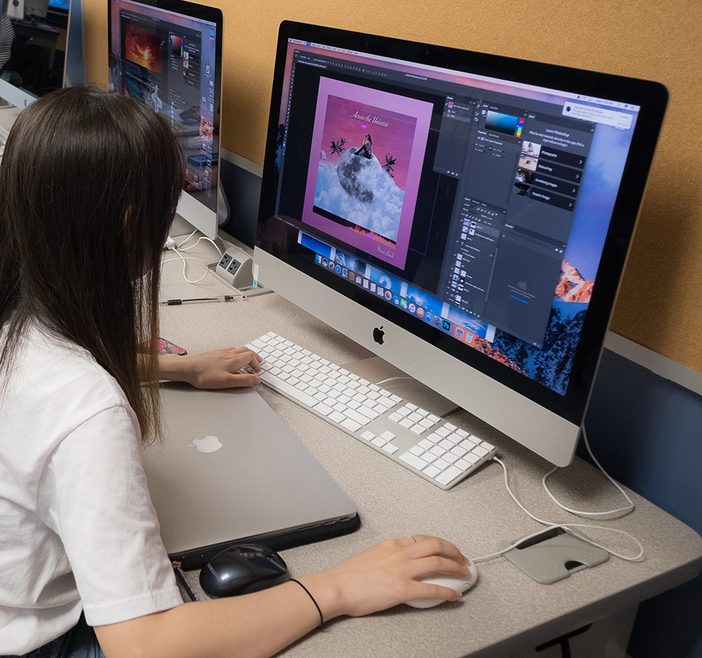 graphic design student on computer