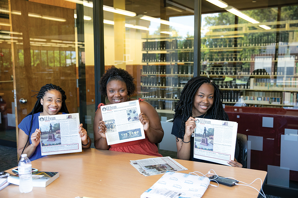 students with newspaper