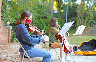 music students performing outside