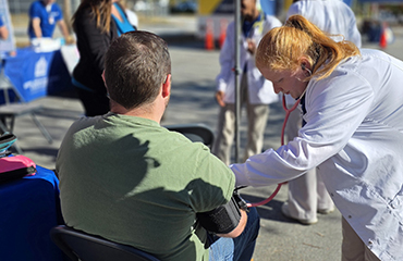 student taking blood pressure