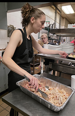Isabella Young serving turkey