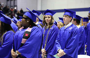 graduates at commencement
