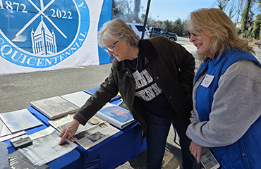 alumni with tent at homecoming