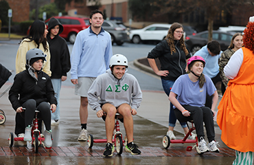 students on trikes