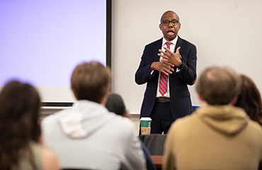 Farai Gwata speaks to class