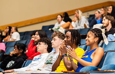 students at basketball watch party