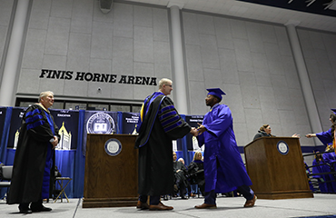 president Richard Cosentino and student at commencement