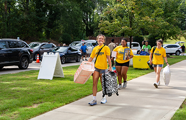 women's rugby team helps move in